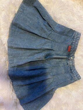 Angelica Blue Denim Pleated Mini Skirt with Red Logo Tab